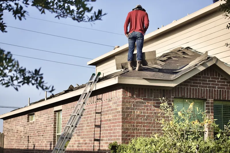 Professional roofer working on a residential roof in Palos Verdes